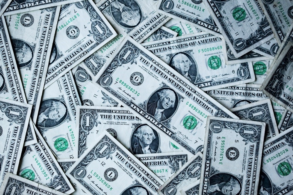 a pile of American $1 bills